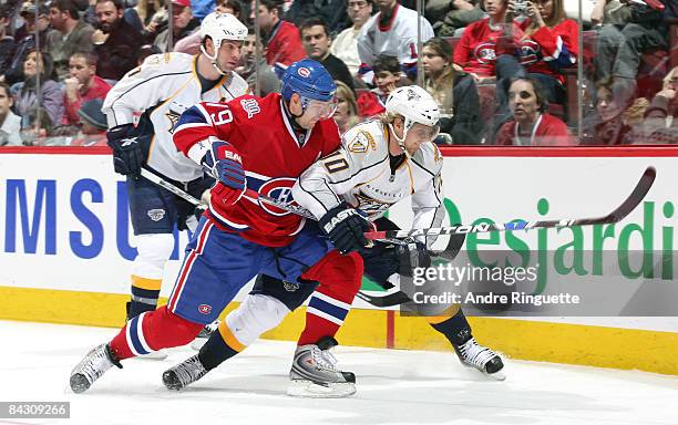 Andrei Markov of the Montreal Canadiens battles for position against Martin Erat of the Nashville Predators at the Bell Centre January 15, 2009 in...