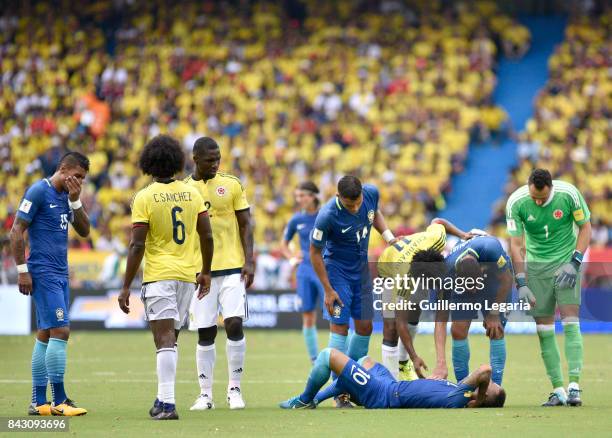 Neymar Jr of Brazil reacts after receiving a foul during a match between Colombia and Brazil as part of FIFA 2018 World Cup Qualifiers at...