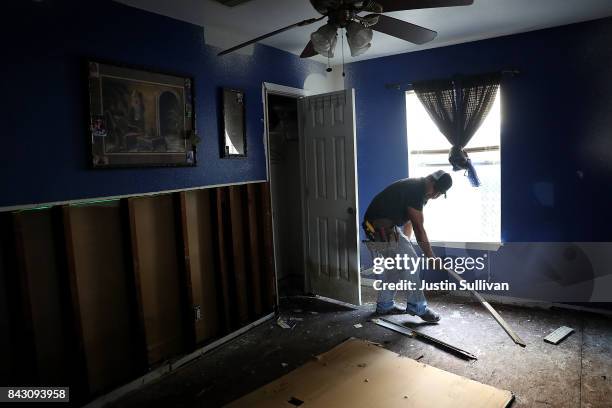 Contractor removes moldy materials from a flood damaged home on September 5, 2017 in Houston, Texas. Over a week after Hurricane Harvey hit Southern...