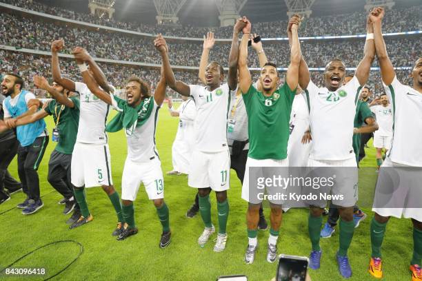Saudi Arabia soccer players celebrate after defeating Japan 1-0 in their final World Cup qualifier in Jeddah on Sept. 5 securing a place at the 2018...