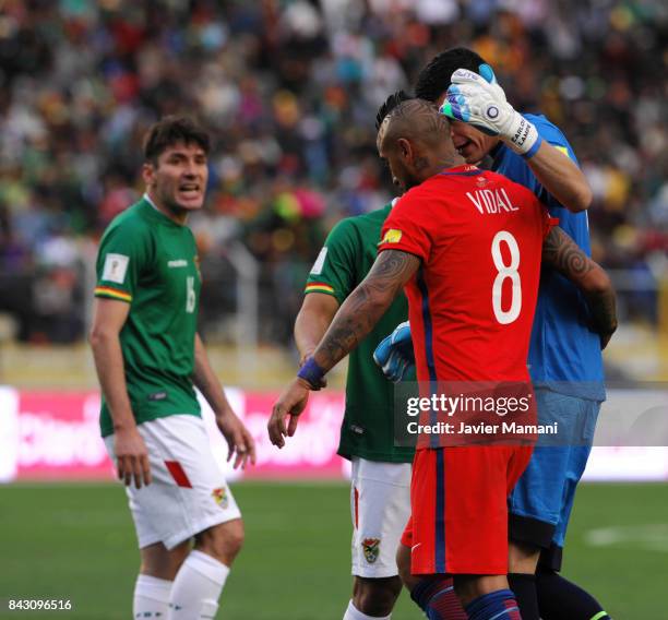 Arturo Vidal of Chile talks with Carlos Lampe goalkeeper of Bolivia during a match between Bolivia and Chile as part of FIFA 2018 World Cup...