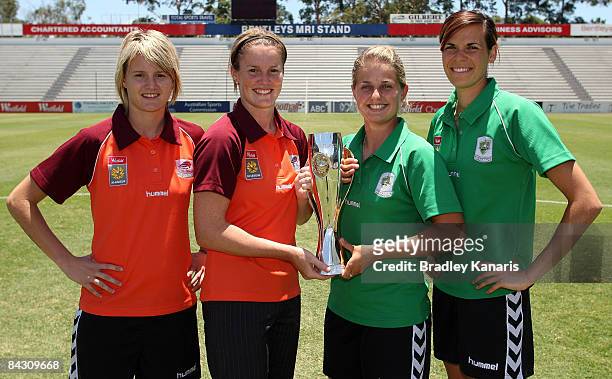 Courtney Beutel and Kate McShae of the Queensland Roar and Ellie Brush and Lydia Williams of Canberra United pose with the inaugural W-League trophy...