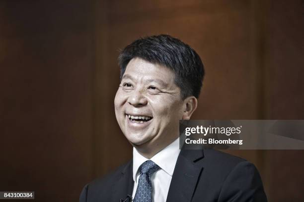 Guo Ping, rotating chief executive officer and deputy chairman of Huawei Technologies Co., reacts during an interview on the sidelines of the Huawei...