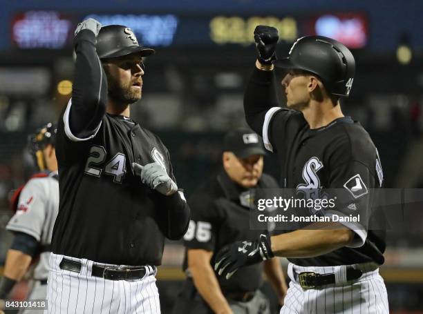 Matt Davidson of the Chicago White Sox is greeted by Rob Brantly after hiting a three run home run in the 1st inning against the Cleveland Indians at...