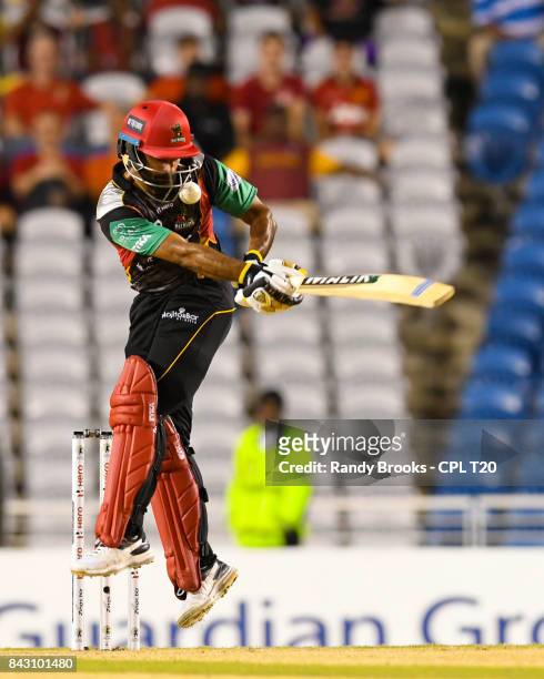 In this handout image provided by CPL T20, Mohammad Hafeez of St Kitts & Nevis Patriots hit on the helmet during the Play Off Match of the 2017 Hero...