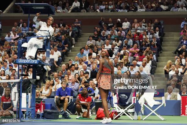 Venus Williams of the US speaks with the umpire as she plays against Czech Republic's Petra Kvitova during their 2017 US Open Women's Singles...