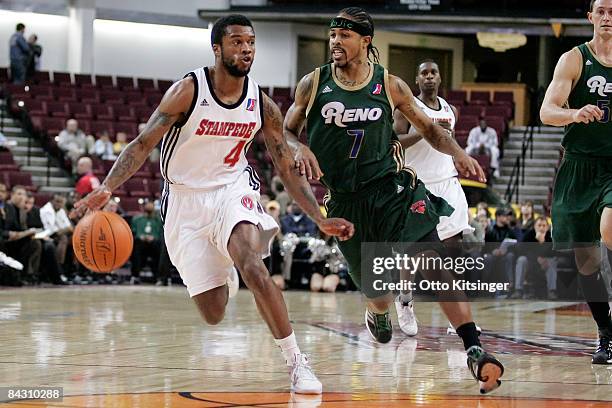 Jamaal Tatum of the Idaho Stampede drives to the basket past Majic Dorsey of the Reno Bighorns during the D-League game on January 15, 2009 at Qwest...