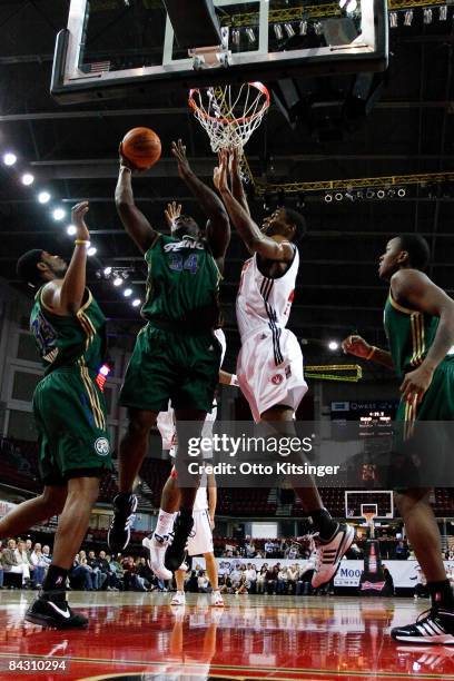 Antonio Meeking of the Reno Bighorns goes up to the basket past Jason Ellis of the Idaho Stampede during the D-League game on January 15, 2009 at...