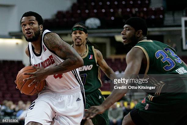 Jamaal Tatum of the Idaho Stampede looks to the basket past Patrick Ewing of the Reno Bighorns during the D-League game on January 15, 2009 at Qwest...