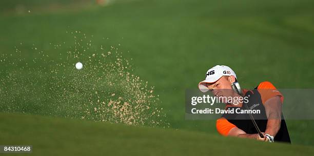 Danny Willet of England hits third shot at the 6th hole during the completion of the first round of the Abu Dhabi Golf Championship held at the Abu...