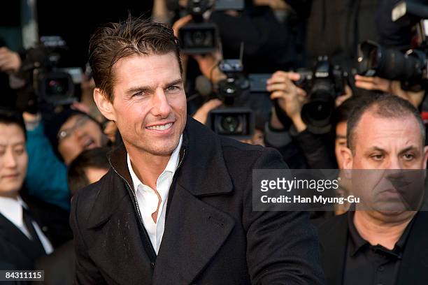 Actor Tom Cruise poses for photographers upon his arrival at Gimpo Airport on January 16, 2009 in Seoul, South Korea. Tom Cruise is visiting South...