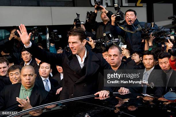Actor Tom Cruise waves to his fans upon his arrival at Gimpo Airport on January 16, 2009 in Seoul, South Korea. Tom Cruise is visiting South Korea to...