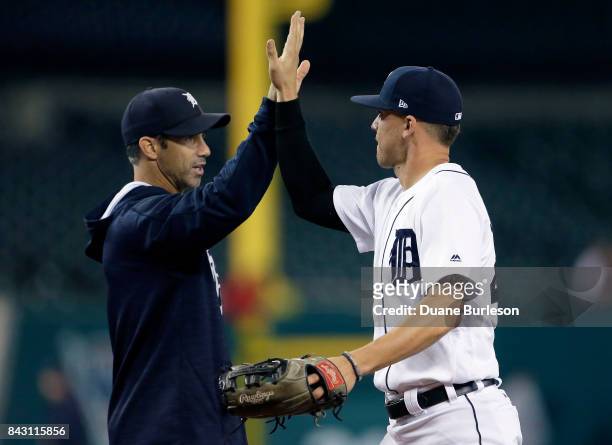 JaCoby Jones of the Detroit Tigers celebrates with manager Brad Ausmus of the Detroit Tigers after a 13-2 win over the Kansas City Royals at Comerica...