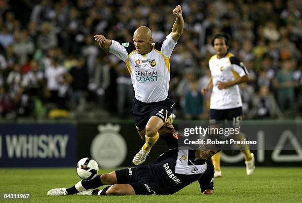 Andre Gumprecht of the Mariners is fouled during the round 20 A-League match between the Melbourne Victory and the Central Coast Mariners at Telstra...