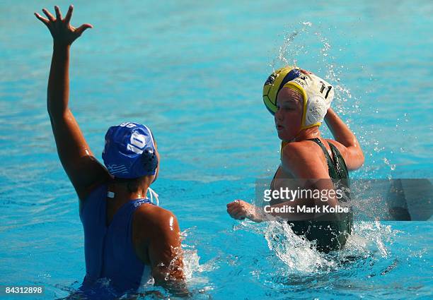 Emmajo Grahame of Australia shoots at goal passed Eleni Farmaki of Greece during water polo match between Australia and Greece held on day three of...