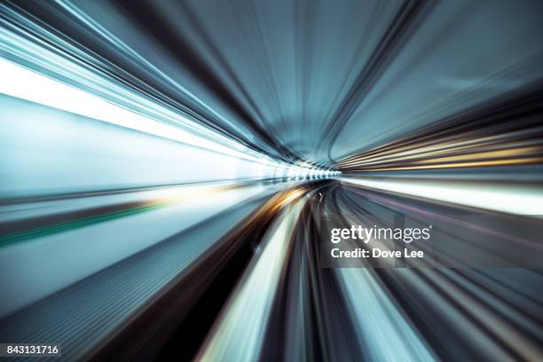 speed and motion in tunnel - long exposure train stock pictures, royalty-free photos & images