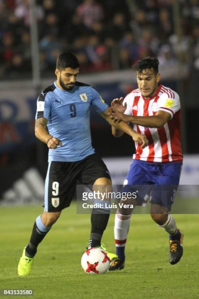 Luis Suarez of Uruguay fights for the ball with Gustavo Gomez of Paraguay during a match between Paraguay and Uruguay as part of FIFA 2018 World Cup...