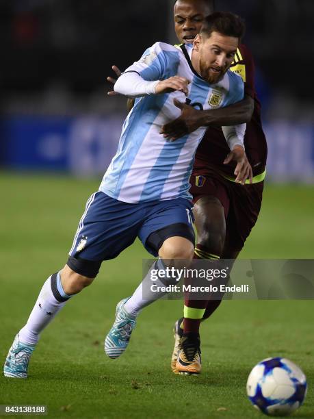 Lionel Messi of Argentina fights for ball with John Murillo of Venezuela during a match between Argentina and Venezuela as part of FIFA 2018 World...