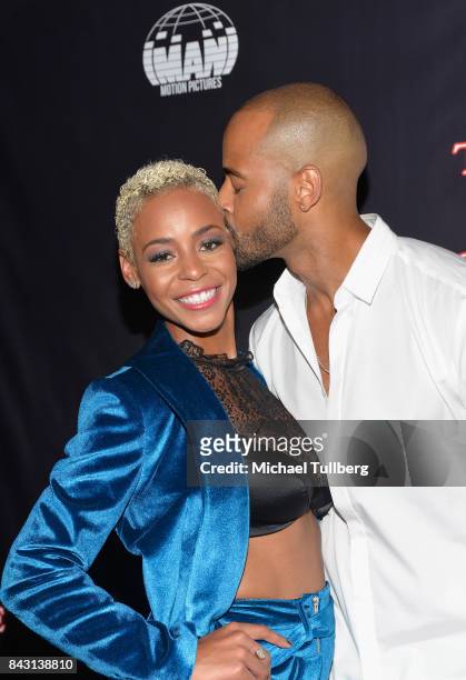Actress Erica Peeples and guest attend the premiere of Imani Motion Pictures' "True To The Game" at Directors Guild Of America on September 5, 2017...