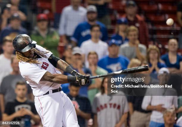 Hanley Ramirez of the Boston Red Sox hits a walk-off single against the Toronto Blue Jays in the nineteenth inning at Fenway Park on September 5,...