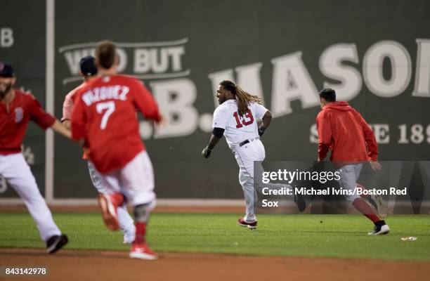 Hanley Ramirez of the Boston Red Sox reacts after hitting a walk-off single against the Toronto Blue Jays in the nineteenth inning at Fenway Park on...