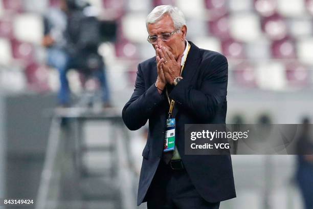 Head coach Marcello Lippi of China reacts during the 2018 FIFA World Cup qualifier game between Qatar and China at Khalifa International Stadium on...