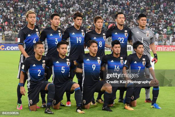 Japan players line up for the team photos prior to the FIFA World Cup qualifier match between Saudi Arabia and Japan at the King Abdullah Sports City...