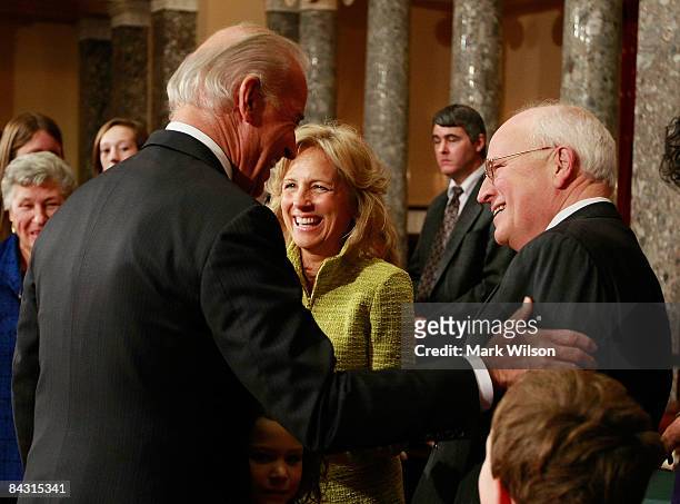 Vice President-Elect Jospeh Biden speaks to Vice President Dick Cheney as Jill Biden looks on at ceremony to swear in appointed Sen. Ted Kaufman in...