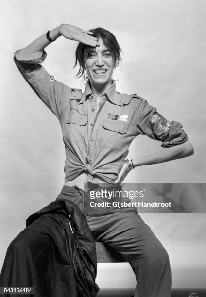 Studio portrait of Patti Smith wearing a US air force shirt, Amsterdam, Netherlands, 9th October 1976.