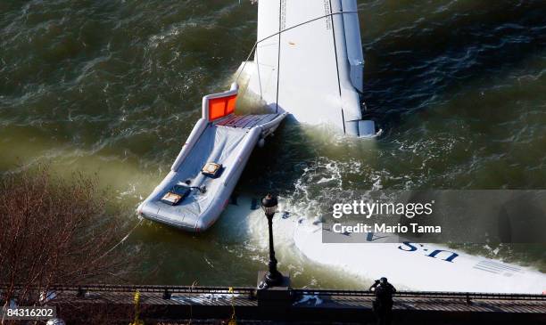 The wreckage of US Airways flight 1549 floats in the Hudson River as investigations into the accident continue on January 16, 2009 near Battery Park...