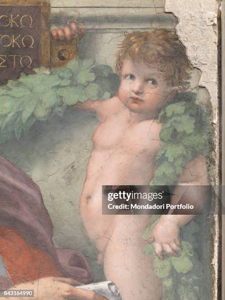 Italy, Lazio, Rome, Basilica di Sant'Agostino in Campo Marzio. Detail. A putto holding a plaque in Greek and a garland.