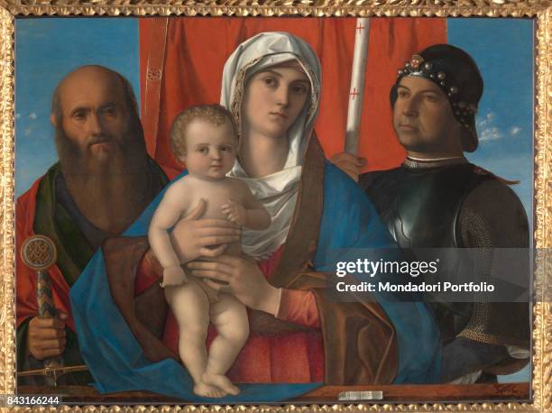 Italy, Veneto, Venice, Gallerie dell'Accademia. Whole artwork view. Virgin Mary holding the Child Jesus. Beside them, Saint Paul holding the hilt of...