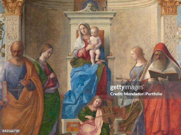 Italy, Veneto, Venice, San Zaccaria Church. Detail. The Madonna and Child enthroned, a musician angel on a step and four saints placed symmetrically...