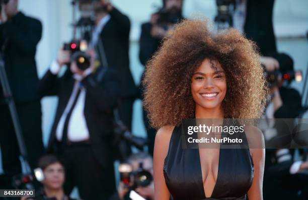 Tina Kunakey walks the red carpet ahead of the 'mother!' screening during the 74th Venice Film Festival at Sala Grande on September 5, 2017 in...