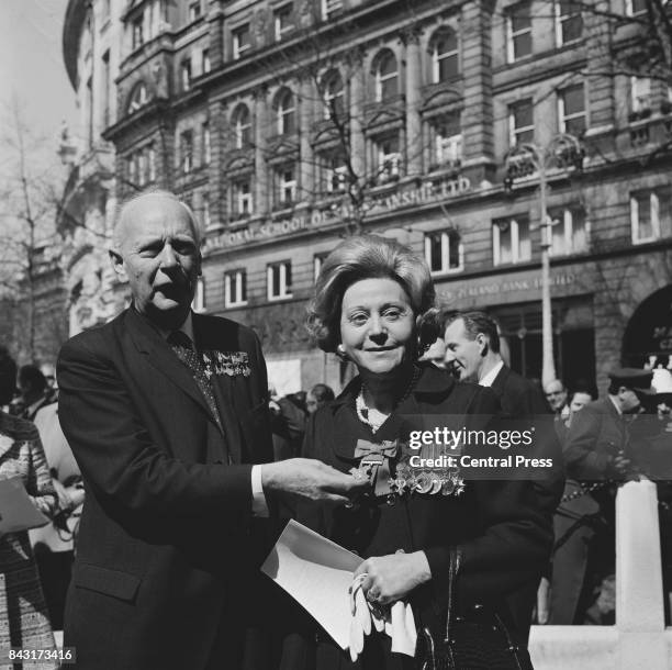 General Marie-Pierre Koenig , wartime leader of the French Resistance, holds the George Cross worn by Odette Hallowes, GC , a former Allied...