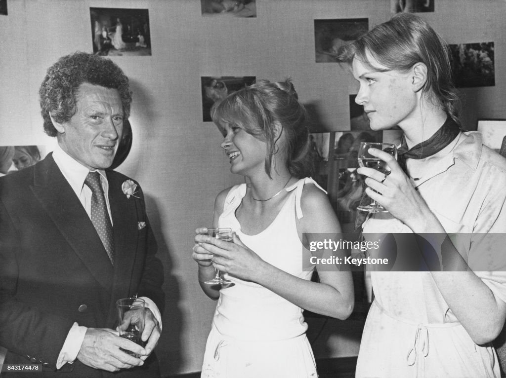 British photographer and film director David Hamilton with two models