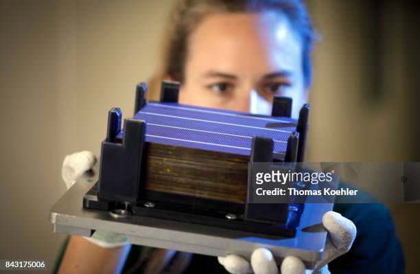 Visual control of a solar cell before the production starts on August 01, 2017 in Frankfurt an der Oder, Germany.