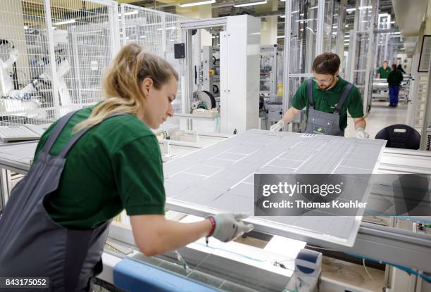 Visual control of a solar cell within in the production process on August 01, 2017 in Frankfurt an der Oder, Germany.