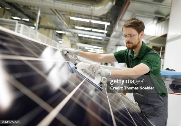 Visual control of a solar panel within the production process on August 01, 2017 in Frankfurt an der Oder, Germany.