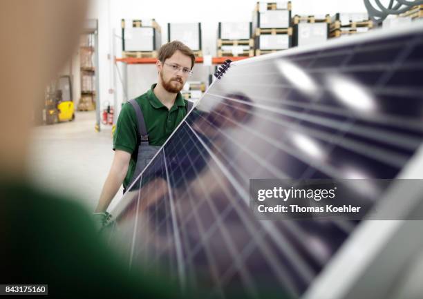Visual control of a solar panel after the production process on August 01, 2017 in Frankfurt an der Oder, Germany.