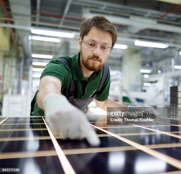 Visual control of a solar panel within the production process on August 01, 2017 in Frankfurt an der Oder, Germany.