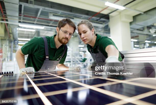 Visual control of a solar panel within the production process on August 01, 2017 in Frankfurt an der Oder, Germany.