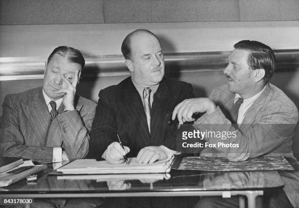From left to right, comedian Tommy Handley , writer Ted Kavanagh and producer and former cricketer Francis Worsley , who are collaborating on the BBC...