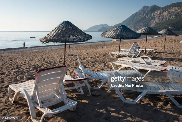 An empty beach and empty beach chairs near the scenic Mount Olympos in Cirali, Turkey in the early morning on 3 September 2017. Turkey's tourism...