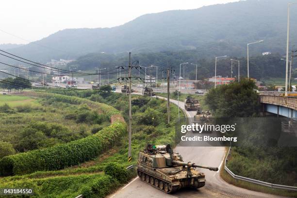 South Korean army tanks travel along a road near the border in Paju, South Korea, on Wednesday, Sept. 6, 2017. North Korean has been seen readying...