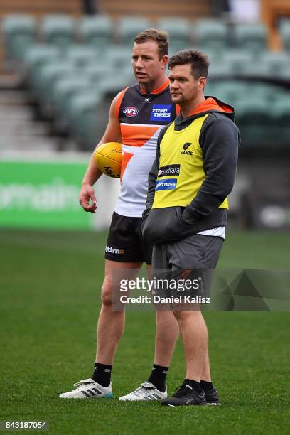 Steve Johnson of the Giants chatrs with a trainer during a Greater Western Sydney Giants AFL training session at Adelaide Oval on September 6, 2017...