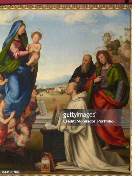 Italy, Tuscany, Florence, Uffizi Gallery. Detail. On the left the Virgin with the baby Jesus in her arms surrounded by a crowd of angels that seem to...