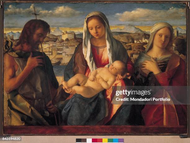 Italy, Veneto, Venice, Gallerie dell'Accademia. Whole artwork view. Virgin Mary holding the Child Jesus. Beside her, Saint John the Baptist and one...