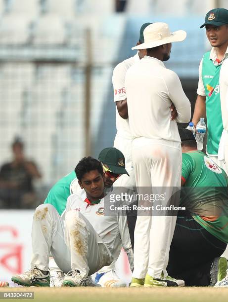 Mehedi Hasan Miraz of Bangladesh is checked after he was struck by a shot from Hilton Cartwright of Australia during day three of the Second Test...