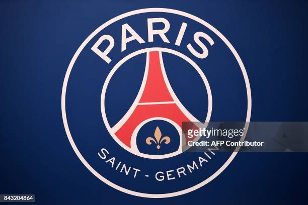 Picture taken on September 6, 2017 shows the logo of the Paris Saint-Germain's L1 football club displayed before a press conference at the Parc des...